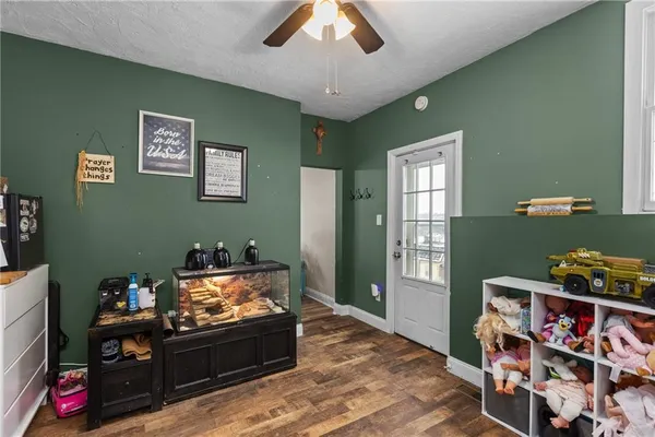 a bedroom with furniture and a flat screen tv