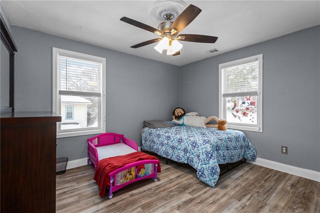 325 East Grant Street Houston, PA 15342 - Photo 20 of 33 a bedroom with two beds and a chandelier