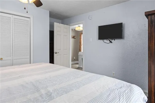 a view of a room that has a window and wooden floor