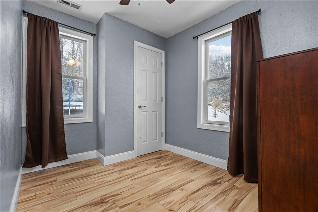 325 East Grant Street Houston, PA 15342 - Photo 24 of 33 a view of a room that has a window and wooden floor