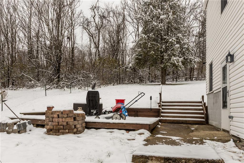 325 East Grant Street Houston, PA 15342 - Photo 33 of 33 a backyard of a house with barbeque oven and outdoor seating