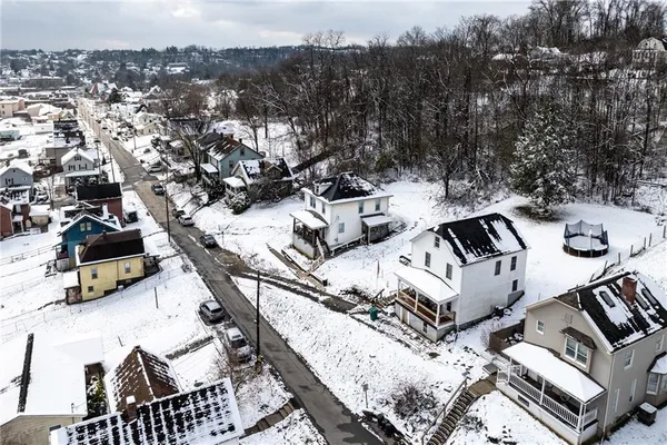 a balcony with table and chairs