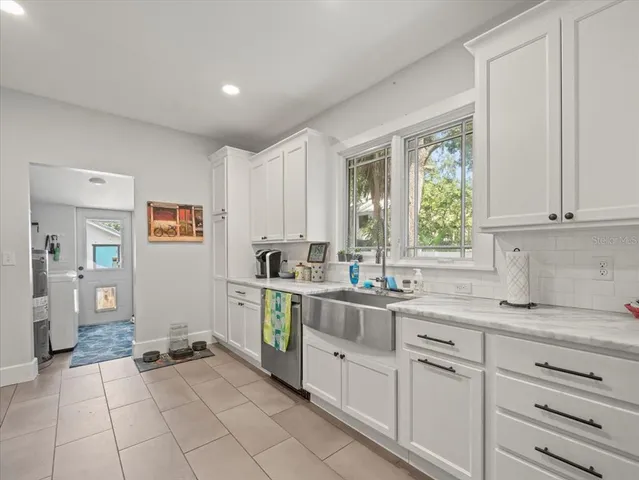 a kitchen with a sink and cabinets