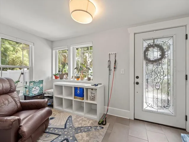a living room with furniture and a window