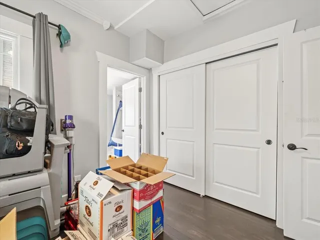 a bedroom with a bed and a mirror