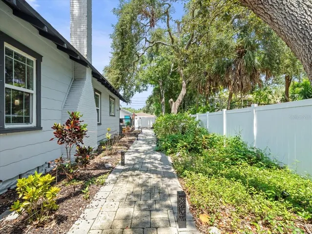 a view of a house with flower plants