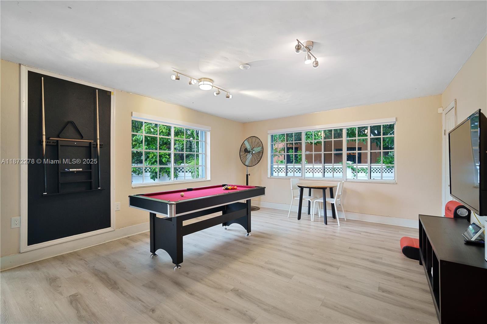 951 Northwest 148th Street Miami, FL 33168 - Photo 13 of 34 a bedroom with furniture and a window