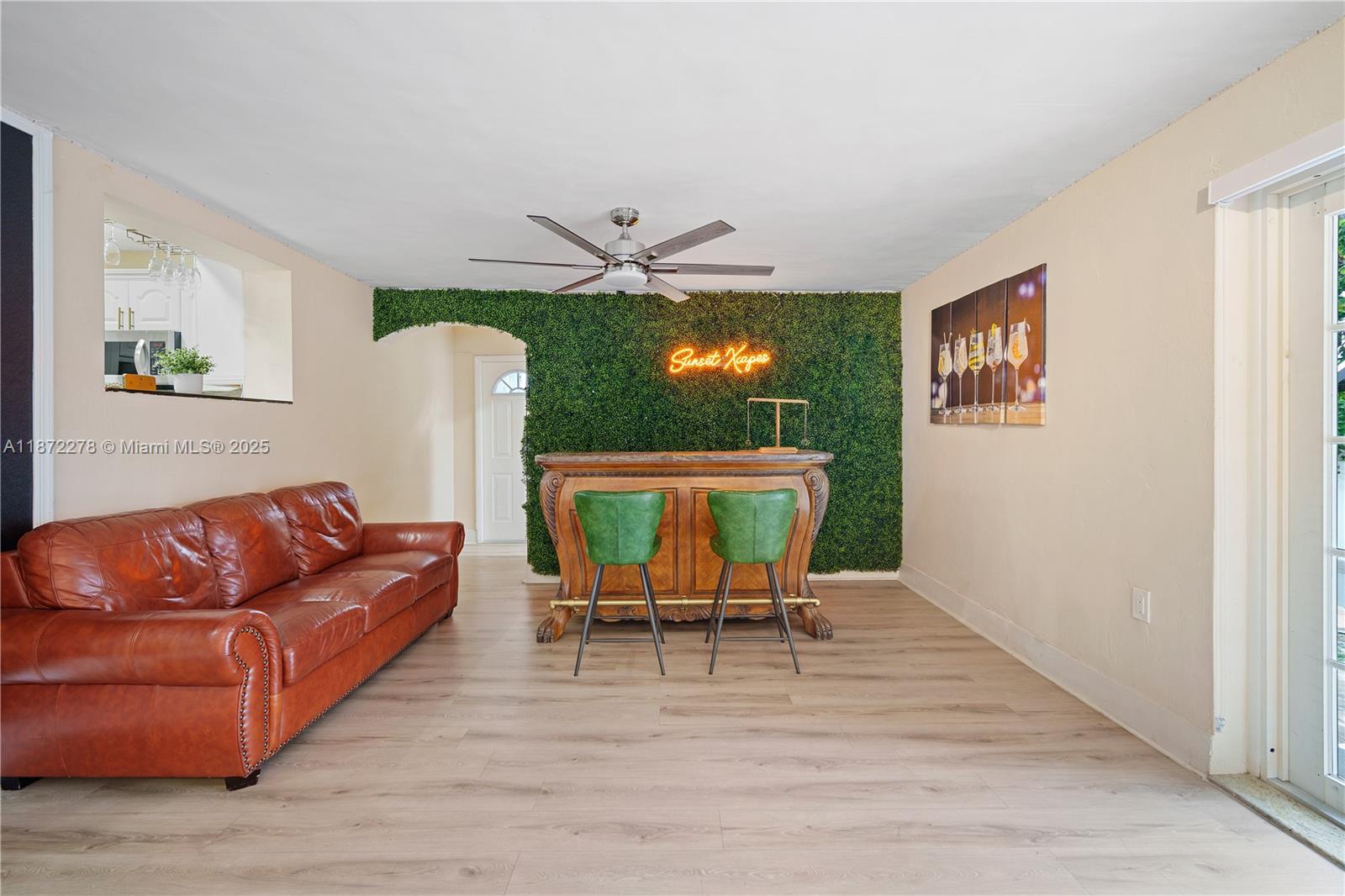 951 Northwest 148th Street Miami, FL 33168 - Photo 17 of 34 a living room with furniture a dining table and a large window