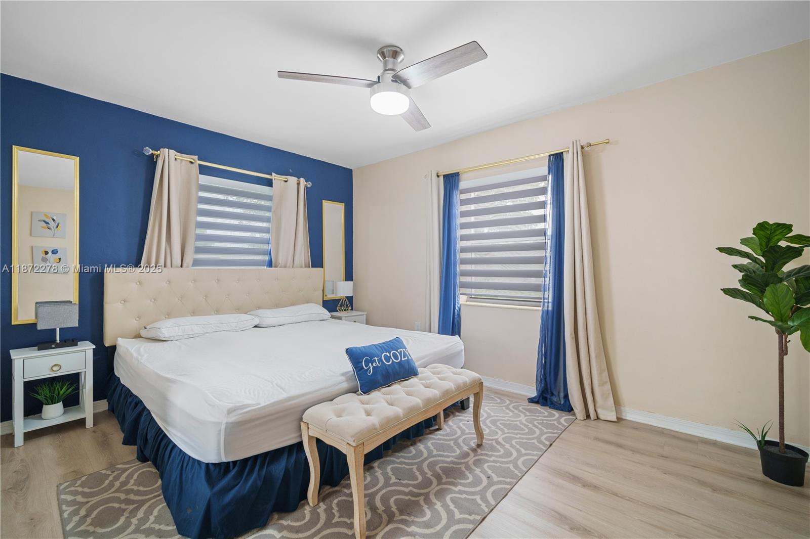 951 Northwest 148th Street Miami, FL 33168 - Photo 23 of 34 a bedroom with a bed and a potted plant