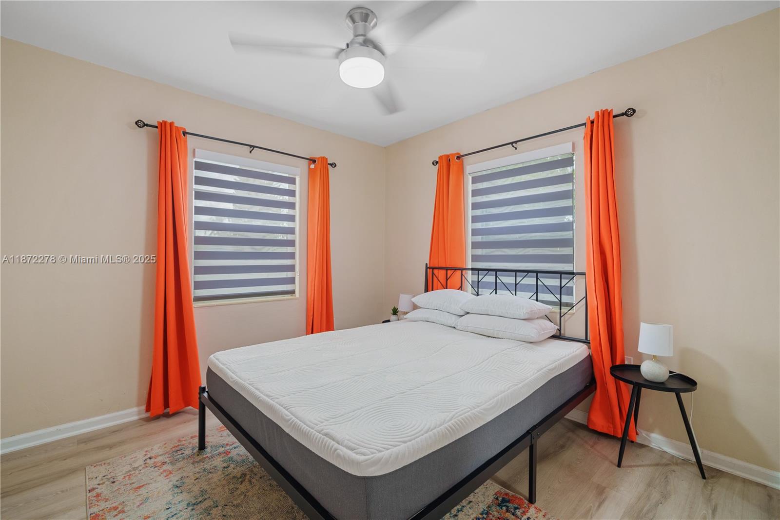 951 Northwest 148th Street Miami, FL 33168 - Photo 25 of 34 a bedroom with a bed and a window