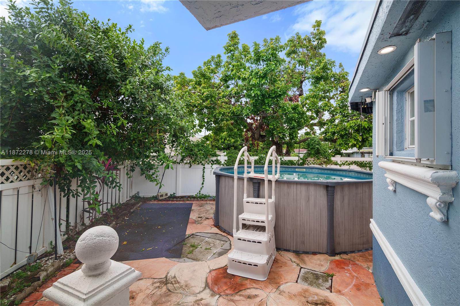 951 Northwest 148th Street Miami, FL 33168 - Photo 29 of 34 a backyard of a house with outdoor seating