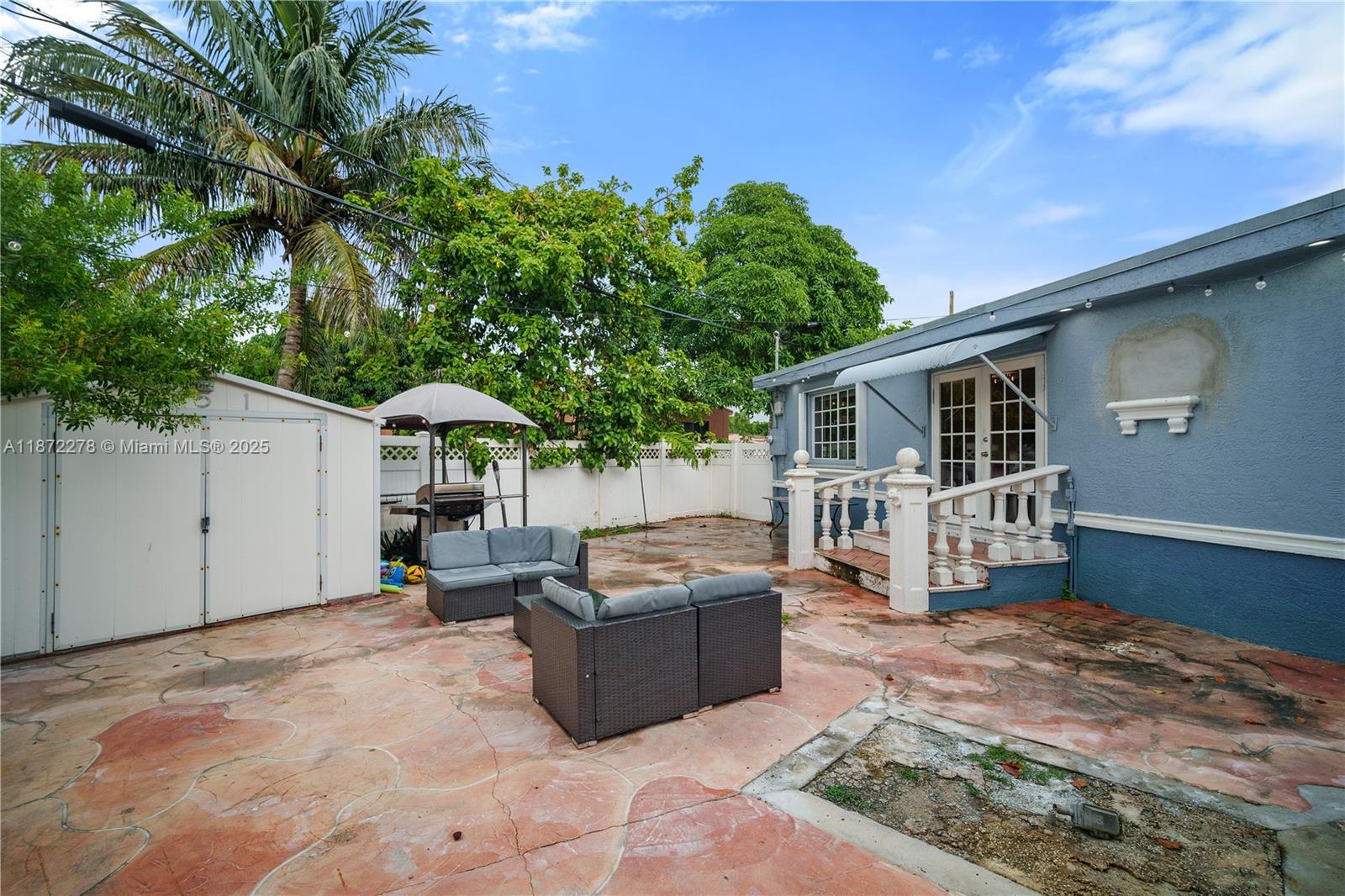 951 Northwest 148th Street Miami, FL 33168 - Photo 30 of 34 a view of a house with backyard and sitting area