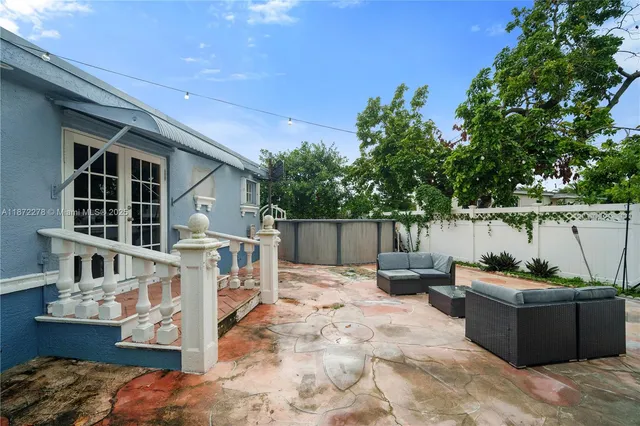 an aerial view of a house with outdoor space and street view