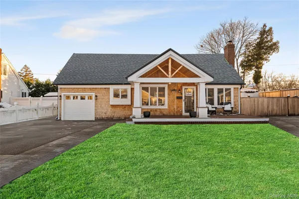 a view of a house with a yard patio and swimming pool