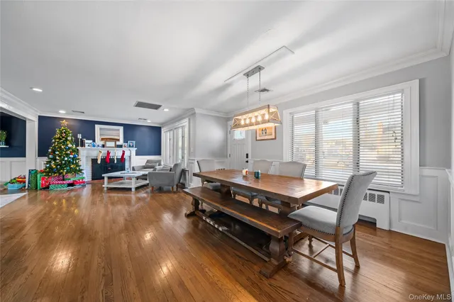 a living room with furniture a wooden floor and a table