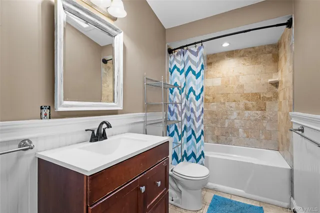 a bathroom with a sink a toilet and a bathtub