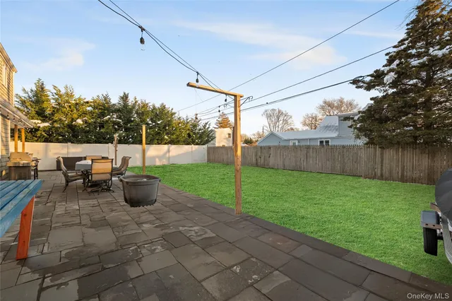 a view of yard with swimming pool and green space