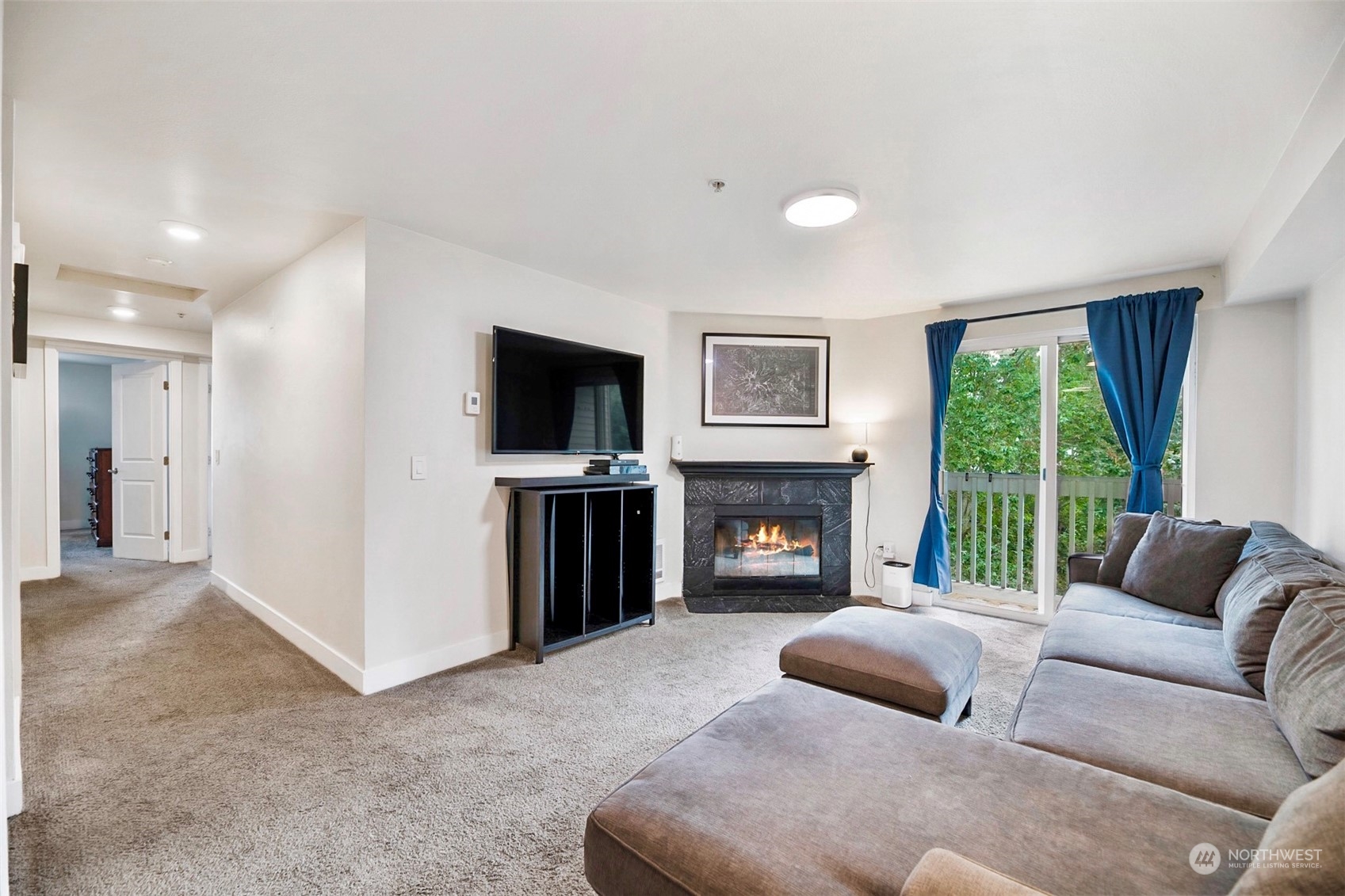 16409 Currie Road Southeast, Unit 305 Monroe, WA 98272 - Photo 7 of 23 a living room with furniture and a fireplace