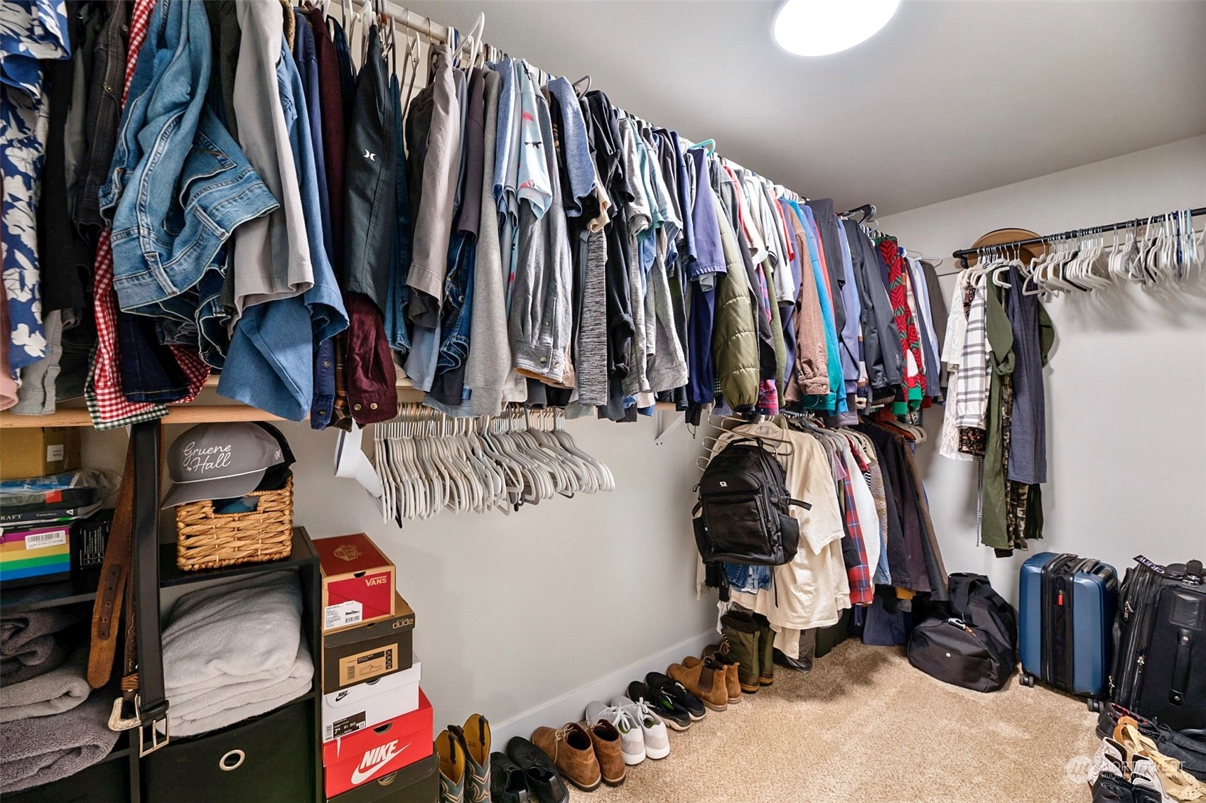 16409 Currie Road Southeast, Unit 305 Monroe, WA 98272 - Photo 10 of 23 a view of walk in closet with clothes and shoes