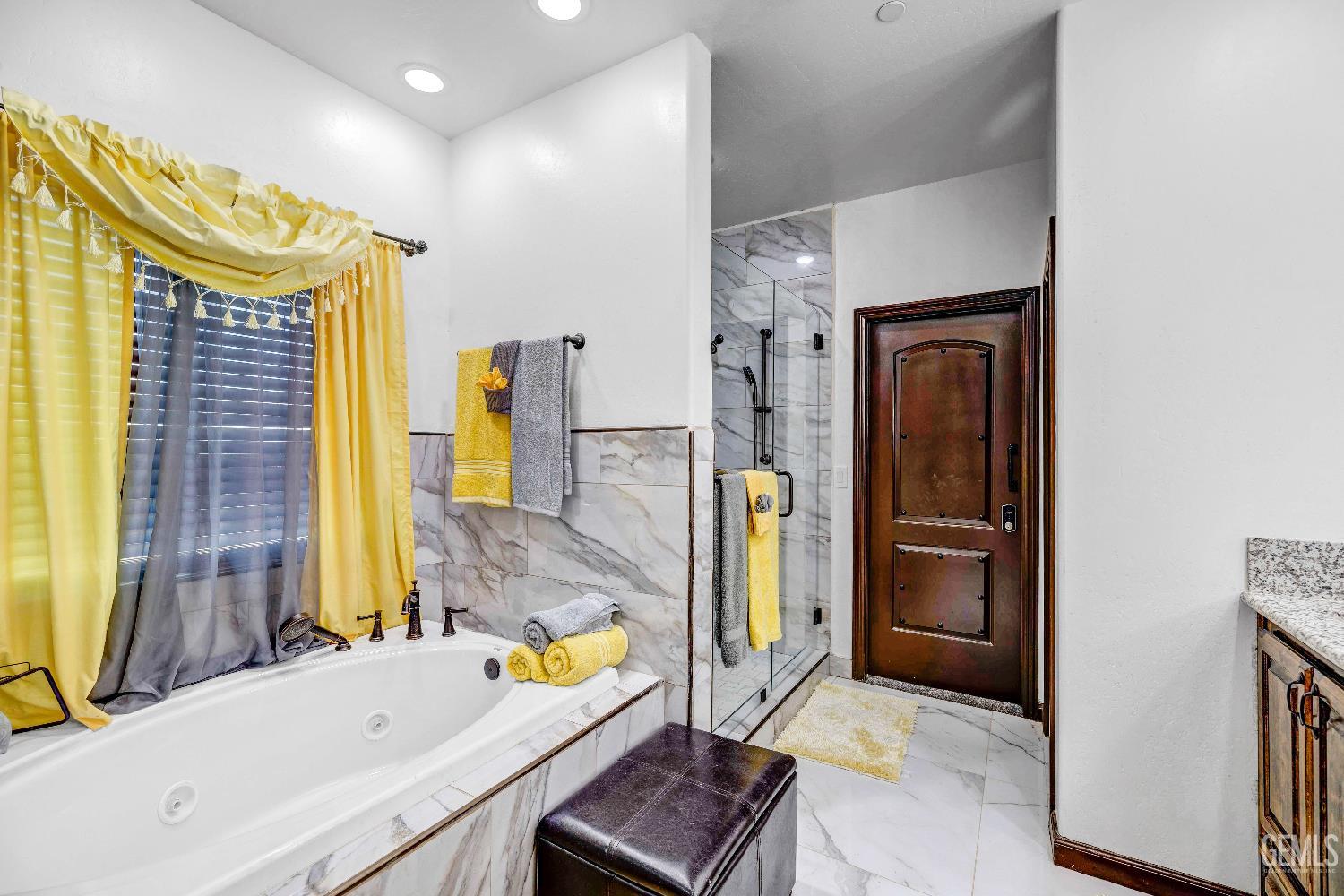 Undisclosed Address Taft, CA 93268 - Photo 26 of 43 a bathroom with a bathtub sink and a mirror