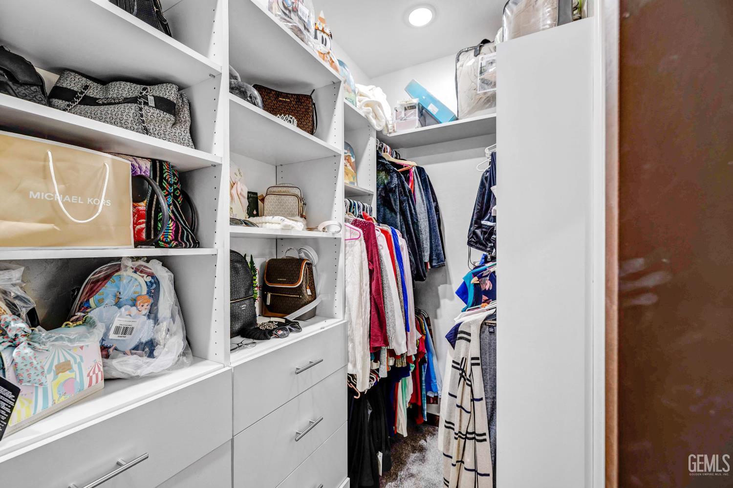 Undisclosed Address Taft, CA 93268 - Photo 30 of 43 a view of walk in closet with clothes and shoes