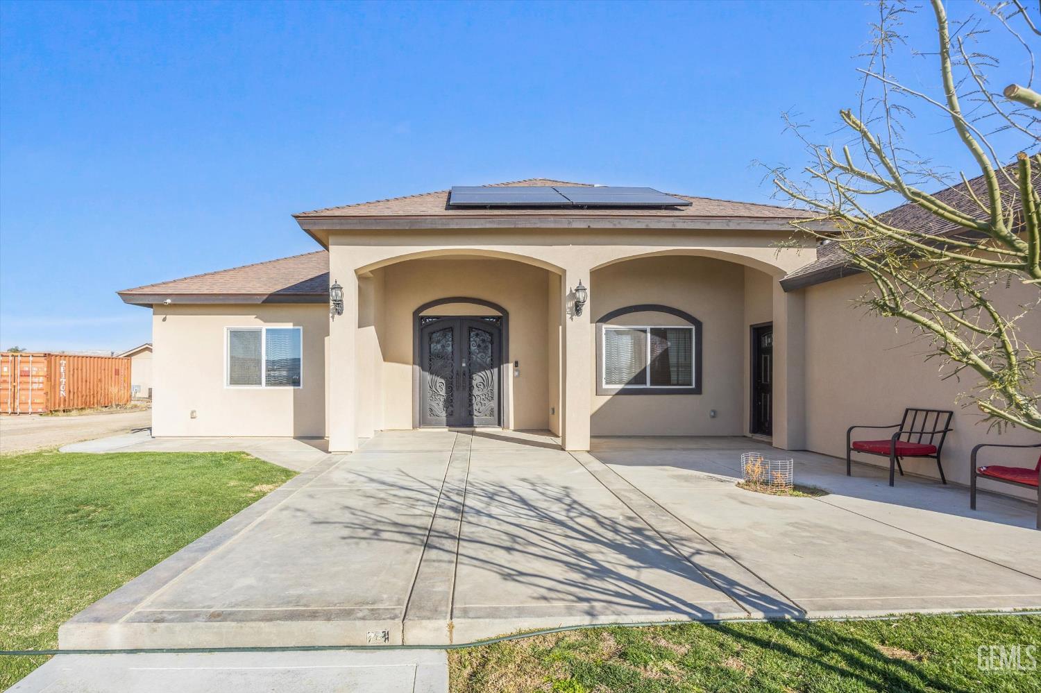 Undisclosed Address Taft, CA 93268 - Photo 3 of 43 a view of a grey house with a yard