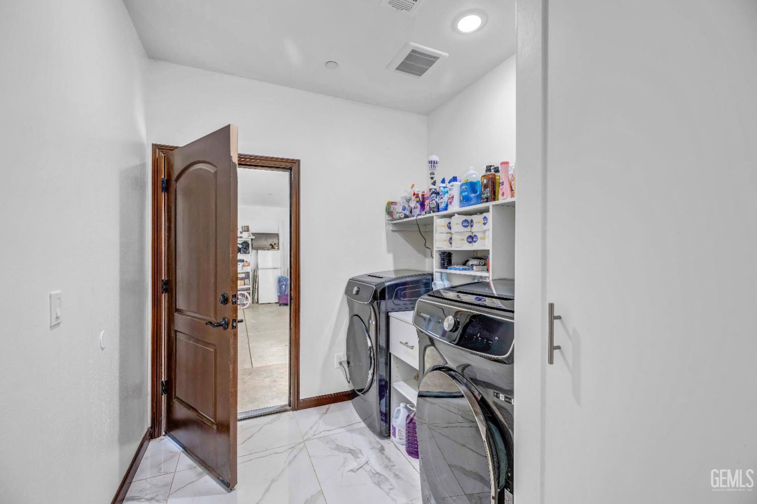 Undisclosed Address Taft, CA 93268 - Photo 31 of 43 a view of walk in closet with clothes and shoes