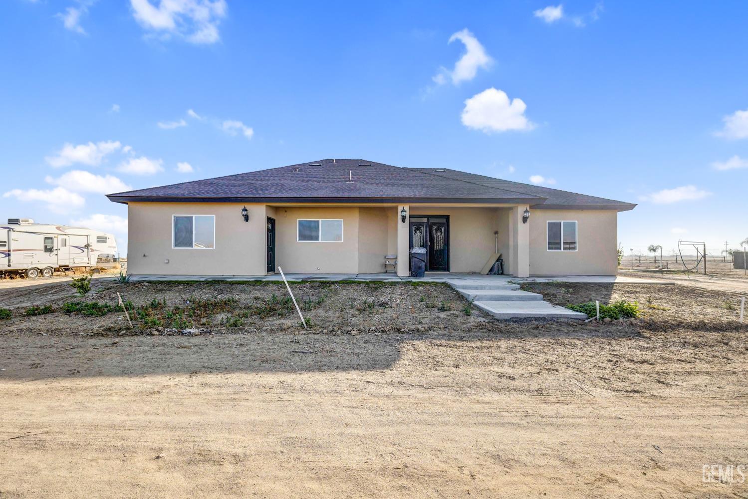 Undisclosed Address Taft, CA 93268 - Photo 37 of 43 a view of a house with a backyard