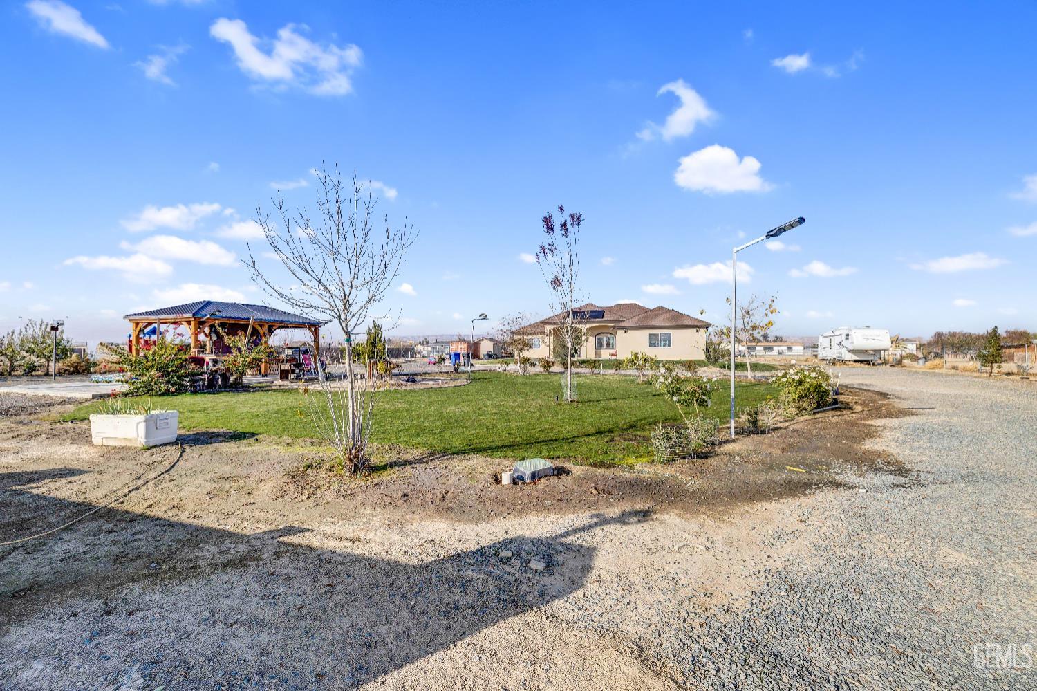 Undisclosed Address Taft, CA 93268 - Photo 5 of 43 a view of a park with large trees