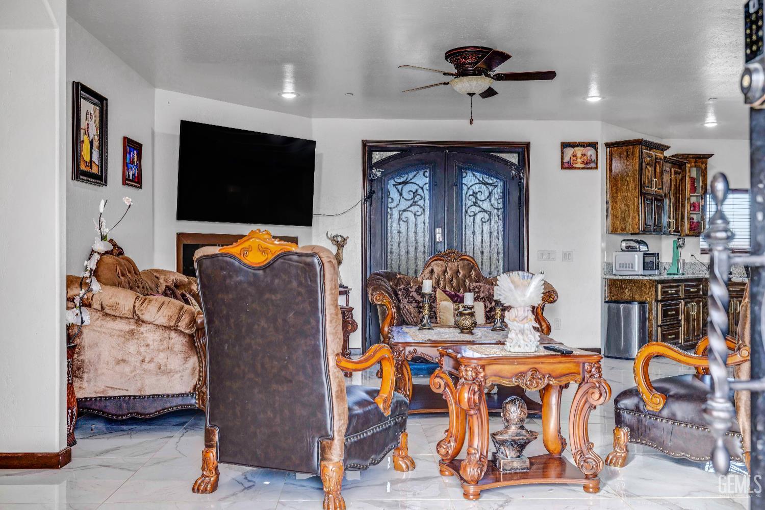 Undisclosed Address Taft, CA 93268 - Photo 6 of 43 a living room with furniture and a flat screen tv