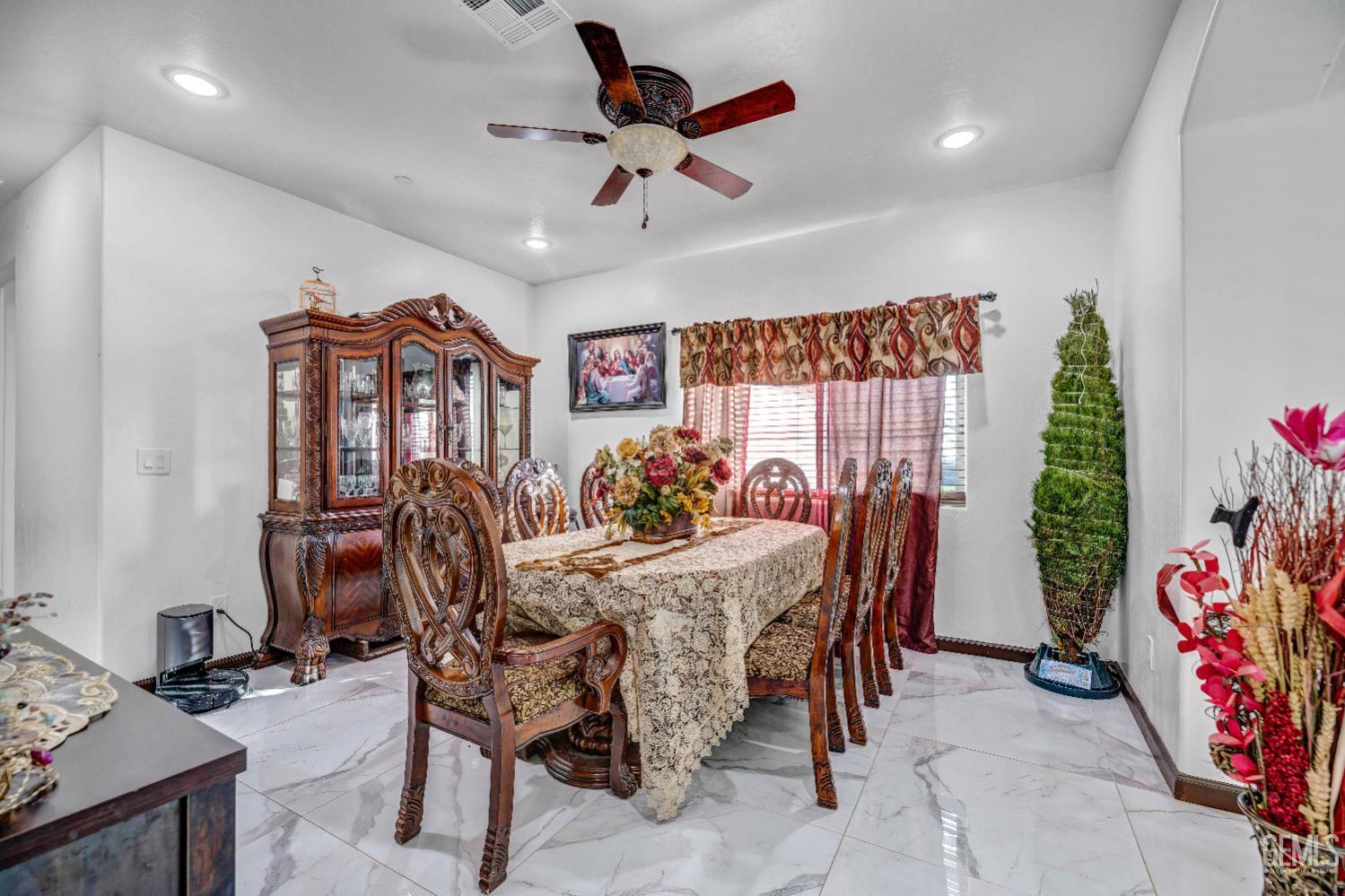Undisclosed Address Taft, CA 93268 - Photo 9 of 43 a view of a dining room with furniture and chandelier