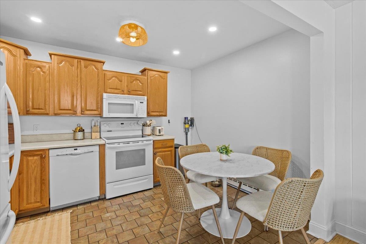 1351 Virginia Cape May, NJ 08204 - Photo 18 of 29 a kitchen with stainless steel appliances a stove a sink cabinets and a dining table