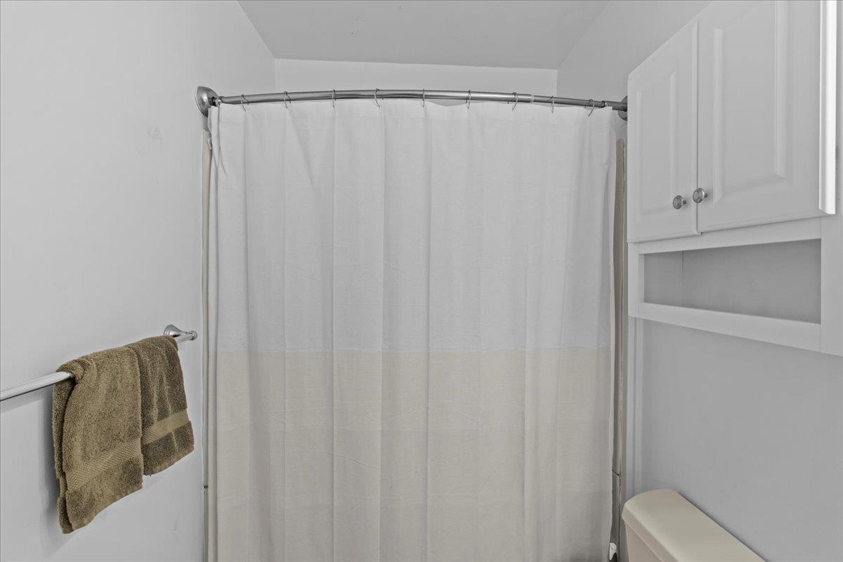 1351 Virginia Cape May, NJ 08204 - Photo 23 of 29 a bathroom with a shower curtain and a sink