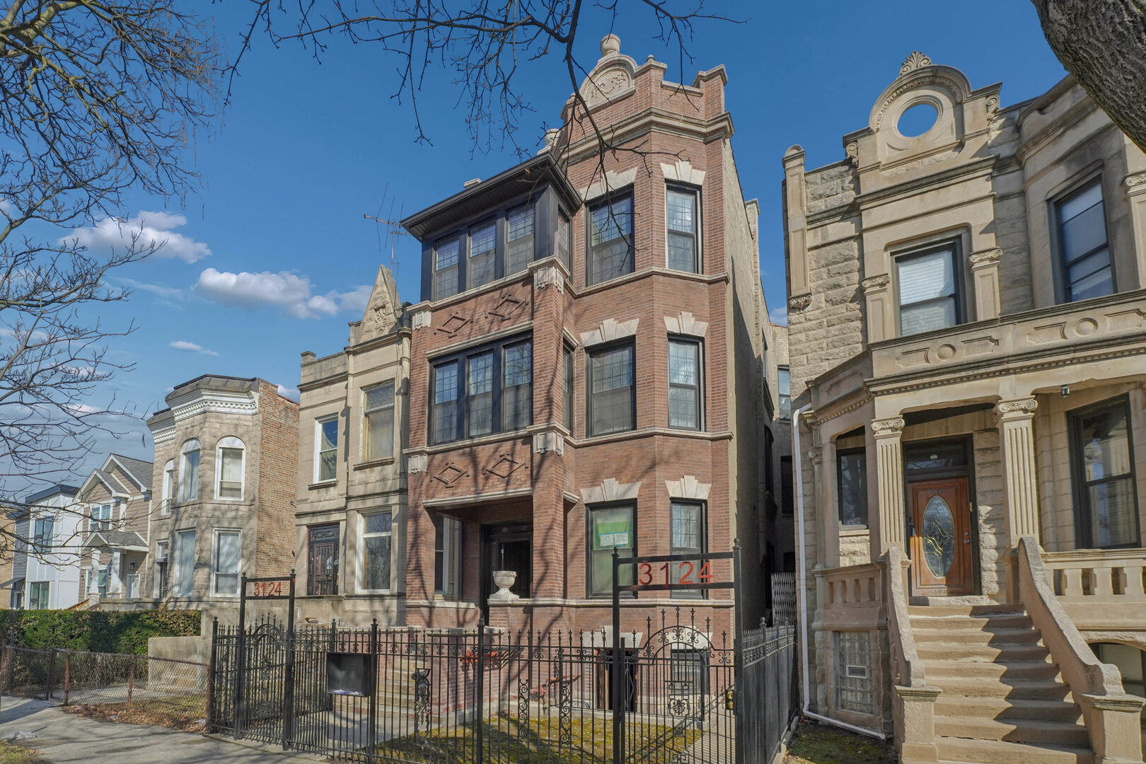 3124 West 15th Place Chicago, IL 60623 - Photo 1 of 17 a front view of a multi story building