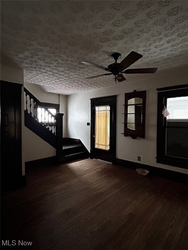 835 Chalker Street Akron, OH 44310 - Photo 4 of 7 Entrance foyer with dark wood-type flooring, ceiling fan, and a textured ceiling