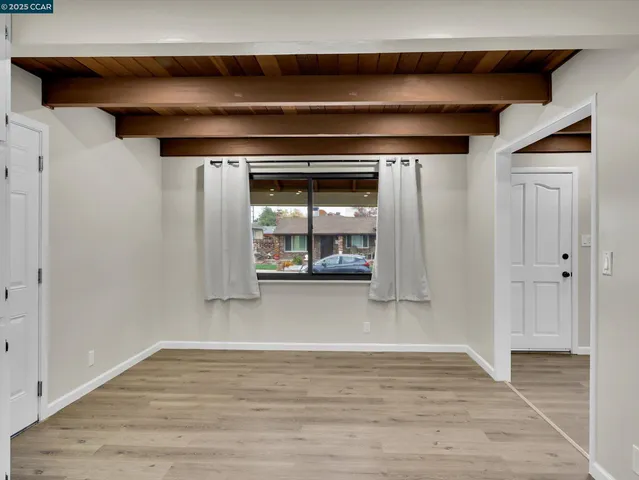 a kitchen with stainless steel appliances a refrigerator sink and microwave