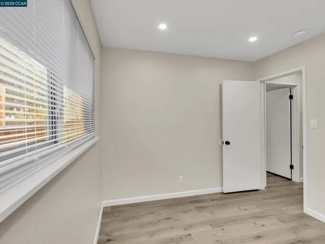 a bathroom with a granite countertop sink a toilet and bathtub