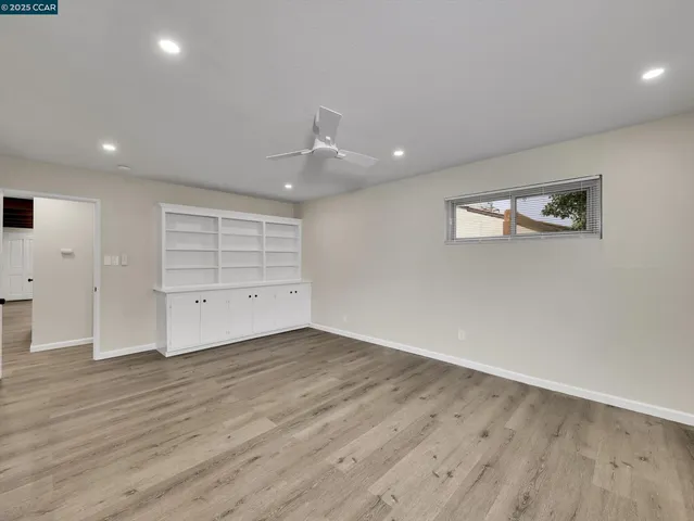 a view of a kitchen with wooden floor