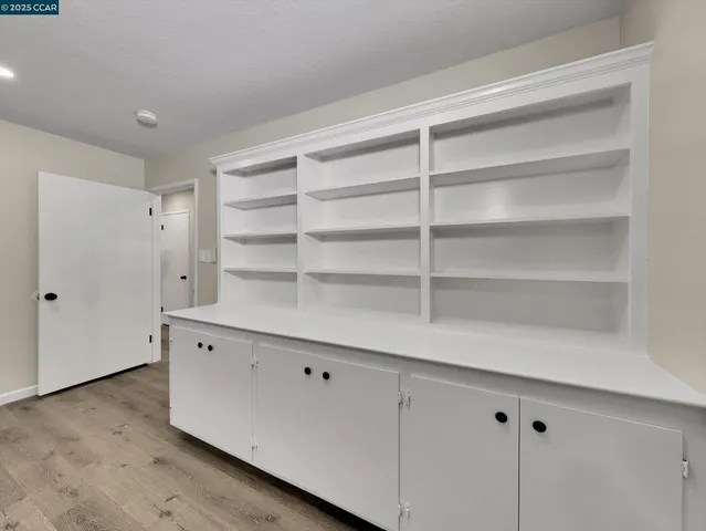 a view of a room with wooden ceiling