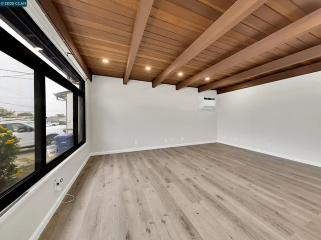 a view of hallway with wooden floor