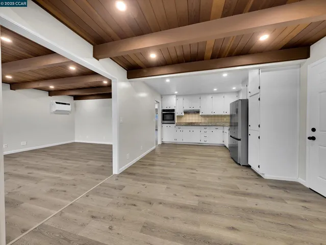 a view of a kitchen with a sink and dishwasher