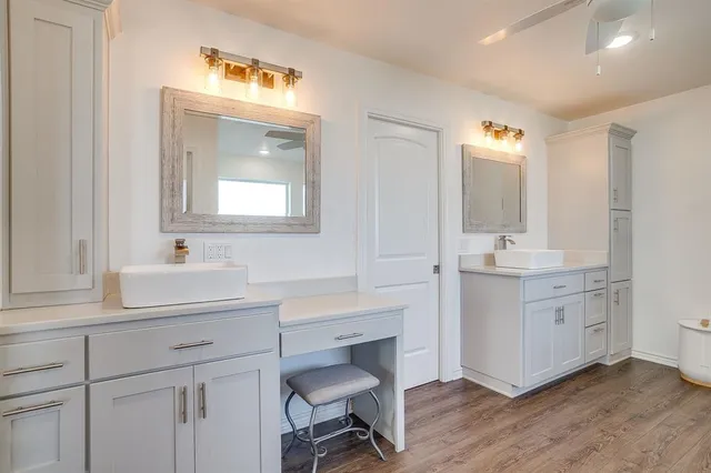 a bathroom with a sink double vanity and a mirror
