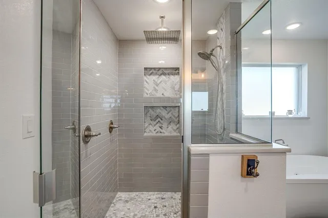 a bathroom with a shower and a sink