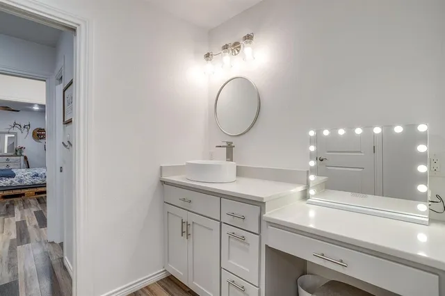 a bathroom with a sink and a mirror