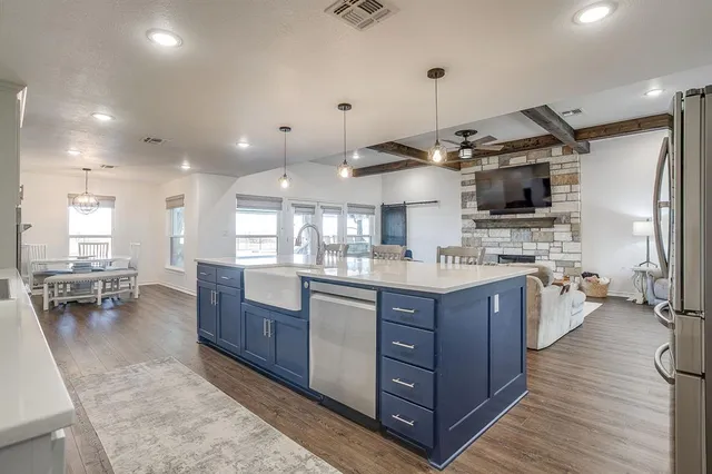 a kitchen with counter top space cabinets and stainless steel appliances