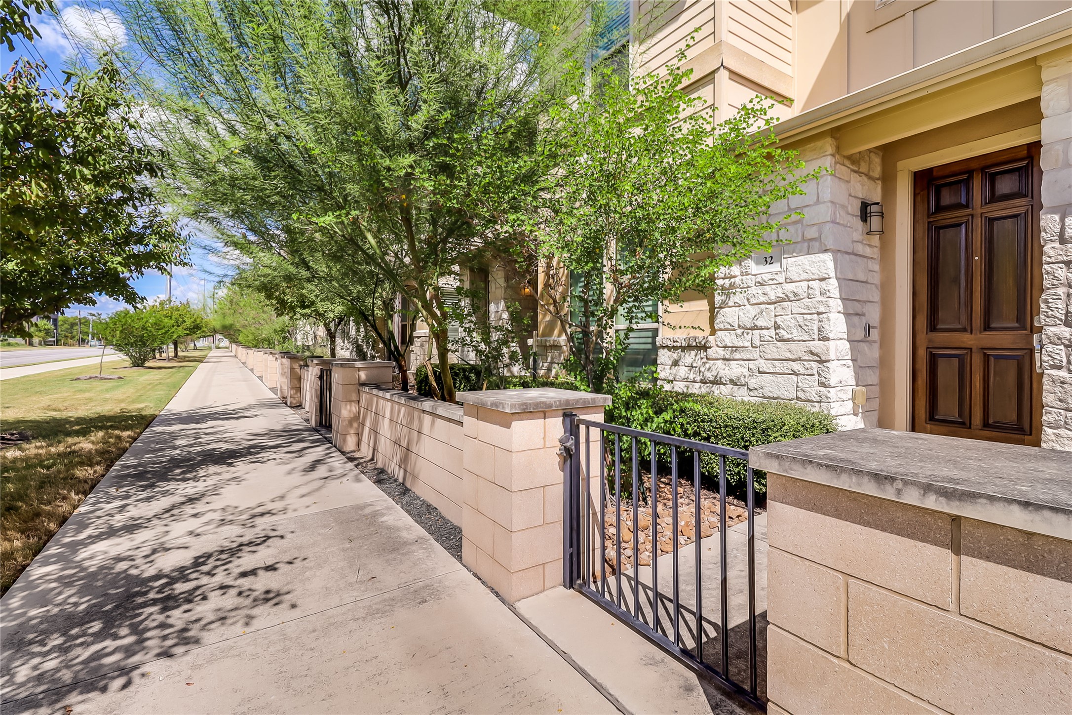 6814 East Riverside Drive, Unit 32 Austin, TX 78741 - Photo 21 of 26 a view of a yard and front view of a house