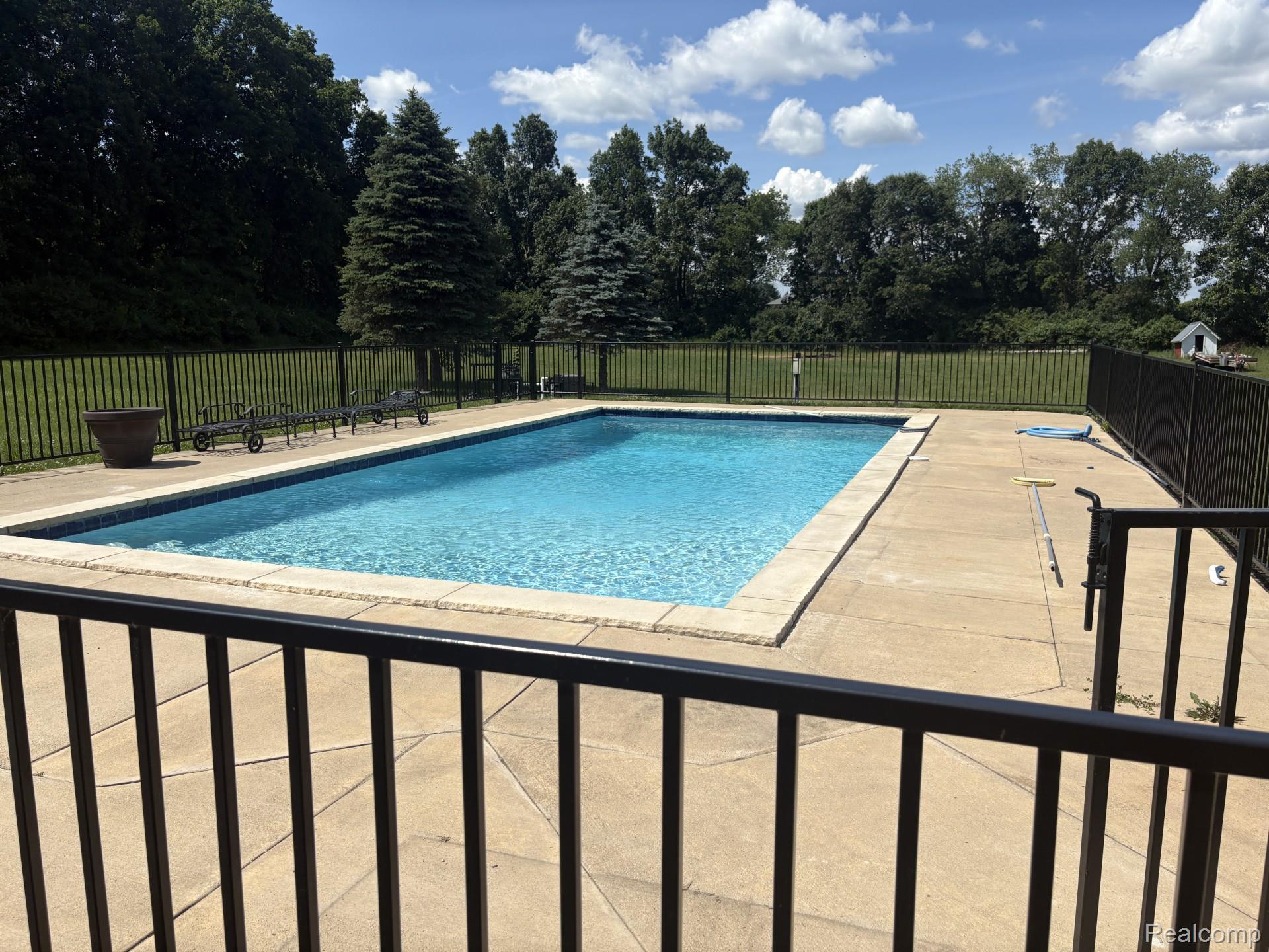 187 Darwin Road Pinckney, MI 48169 - Photo 4 of 71 Private back yard in-ground pool