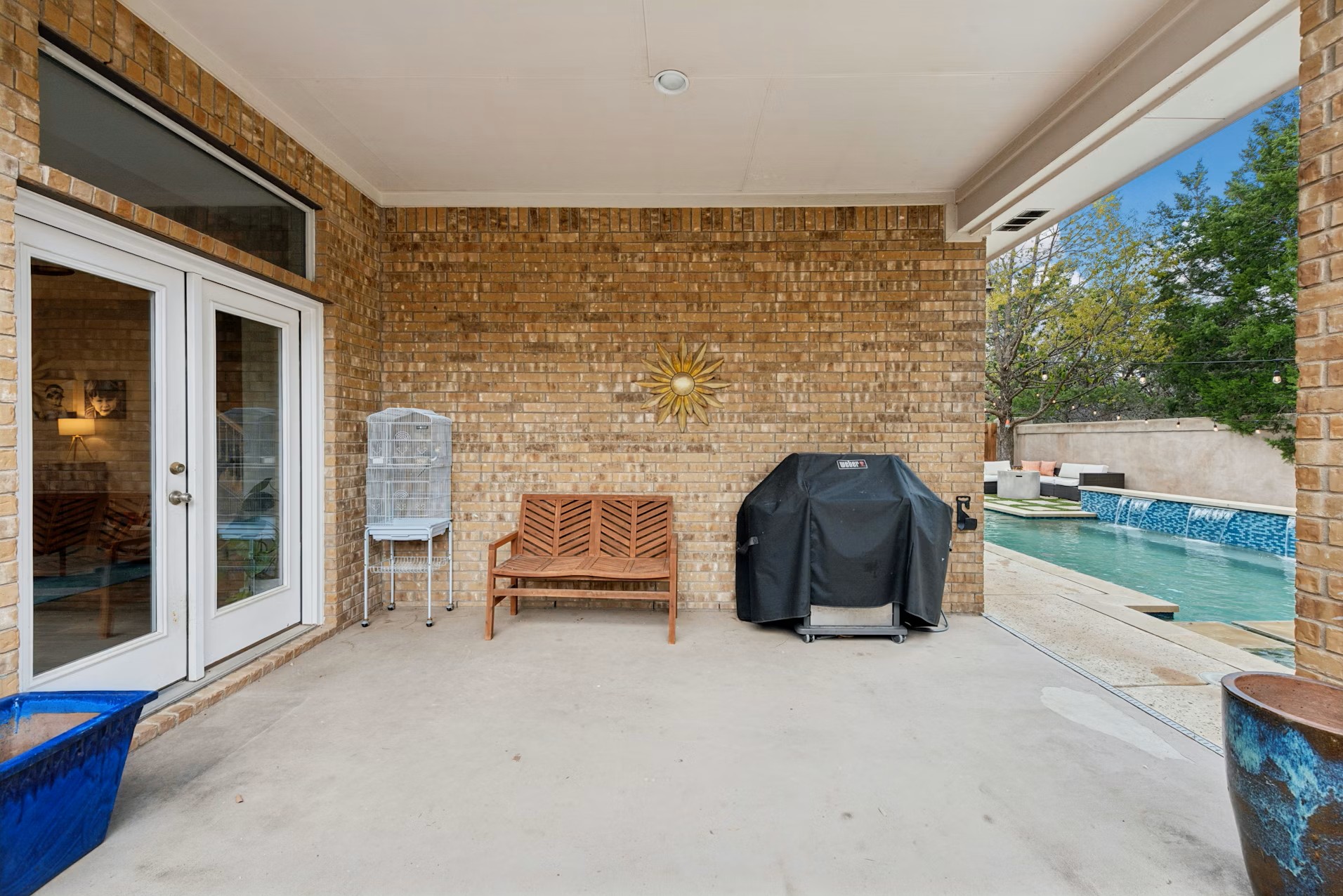 320 El Socorro Lane Austin, TX 78732 - Photo 37 of 40 a view of a patio with table and chairs and potted plants