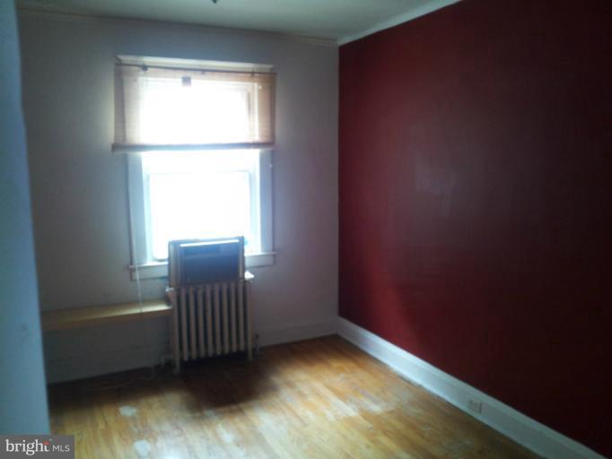 624 Stamford Road Baltimore, MD 21229 - Photo 14 of 21 a view of a small space with wooden floor and a window