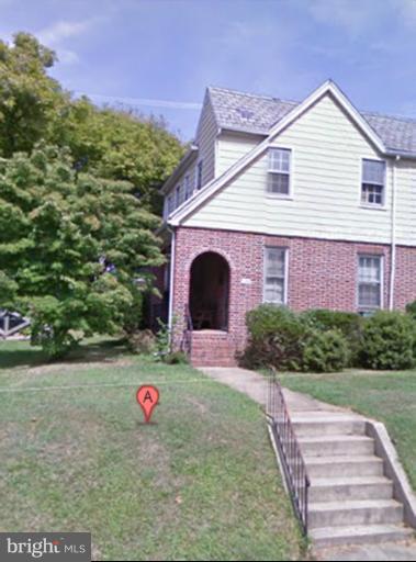 624 Stamford Road Baltimore, MD 21229 - Photo 21 of 21 a view of a brick house with a yard